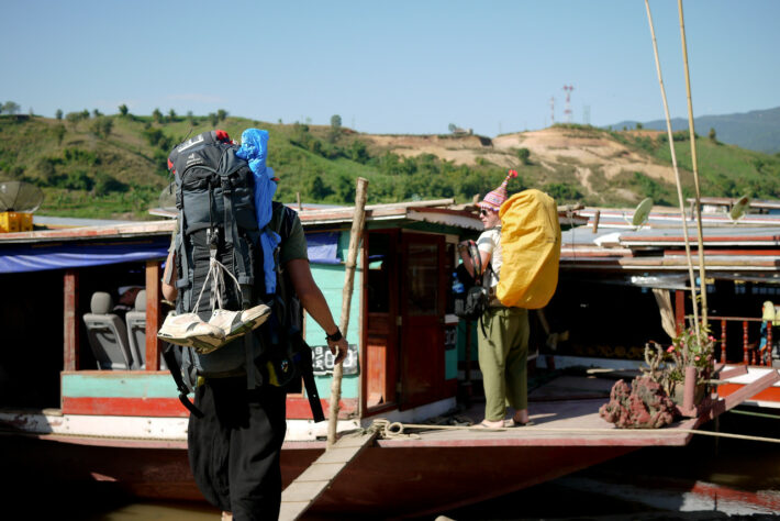 backpackers on the slow boat in loas