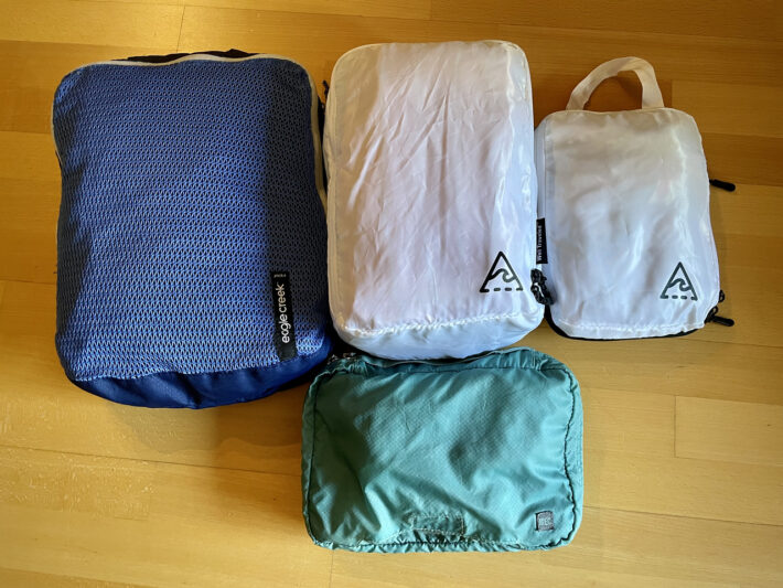 A pile of packed packing cubes